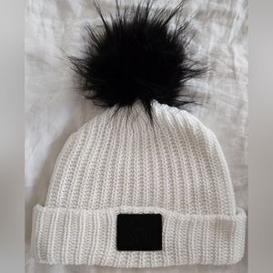 Love your Melon white pom with black leather patch